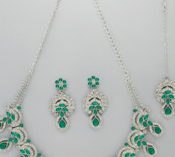 Alluring Traditional Rhodium Plated Green AD Stone Collar Bone Necklace Set With Earring And Maangtika | Jewellery Set For Women