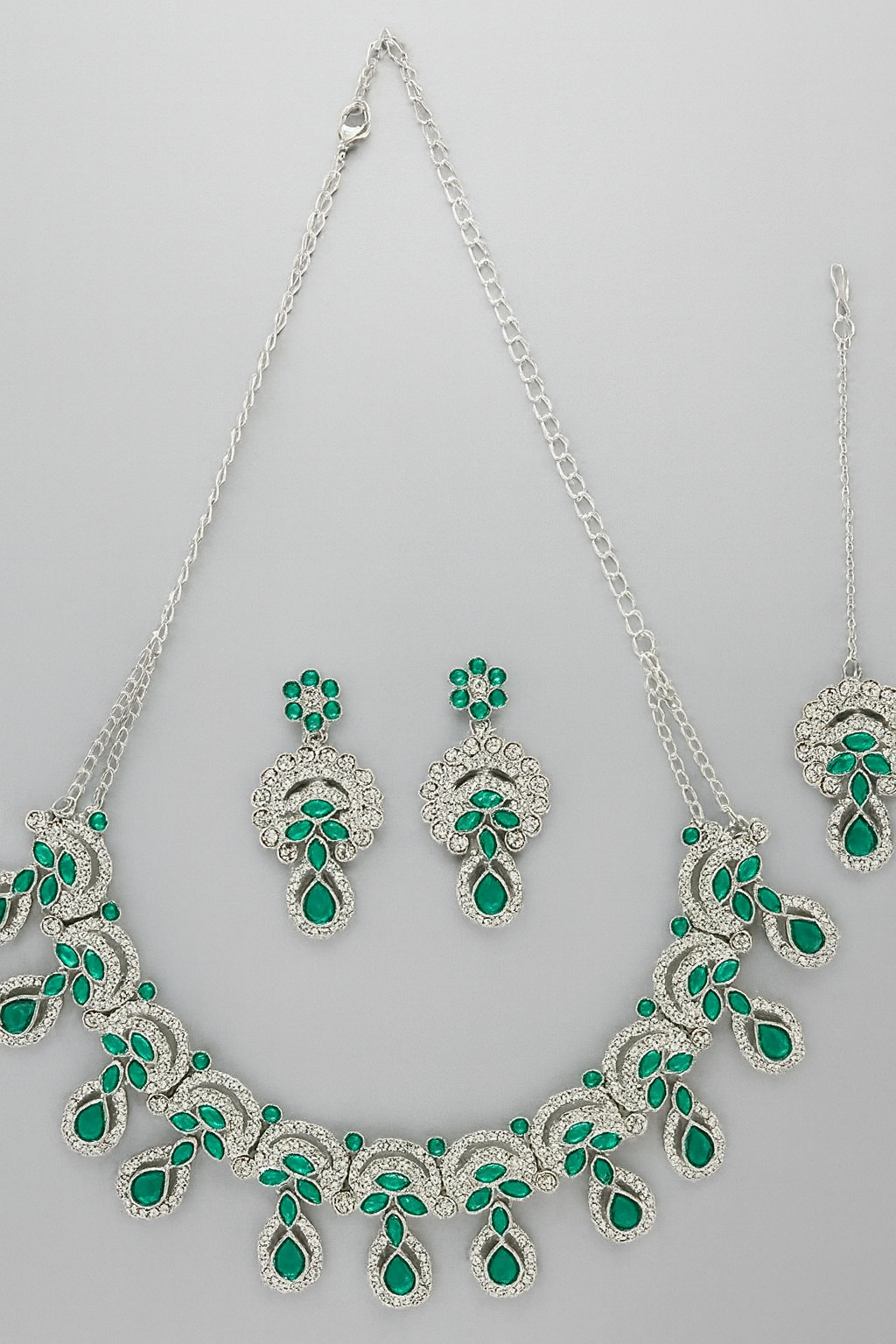 Alluring Traditional Rhodium Plated Green AD Stone Collar Bone Necklace Set With Earring And Maangtika | Jewellery Set For Women
